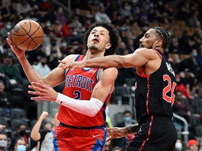 Mar 3, 2022; Toronto, Ontario, CAN;  Detroit Pistons guard Cade Cunningham (2) is fouled by Toronto Raptors center Khem Birch (24) in the first half at Scotiabank Arena. Mandatory Credit: Dan Hamilton-USA TODAY Sports