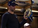 John Tavares with a championship belt for the Toronto Maple Leafs.