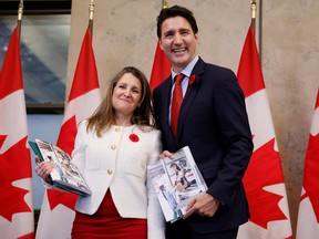 Canada's Deputy Prime Minister and Minister of Finance Chrystia Freeland and Canada's Prime Minister Justin Trudeau stop for a photo before delivering the fall economic statement on Parliament Hill in Ottawa, Ontario, Canada Nov. 3, 2022.