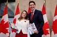 Deputy Prime Minister and Minister of Finance Chrystia Freeland and Prime Minister Justin Trudeau stop for a photo before delivering the fall economic statement on Parliament Hill in Ottawa, Thursday, Nov. 3, 2022.