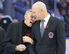 Former Toronto Maple Leafs players and members of the Hockey Hall of Fame Borje Salming and Mats Sundin share a moment as they take part in a pregame ceremony prior to NHL hockey action between the Toronto Maple Leafs and Pittsburgh Penguins, in Toronto, Friday, Nov. 11, 2022. THE CANADIAN PRESS/Frank Gunn