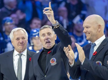 Former Toronto Maple Leafs players and members of the Hockey Hall of Fame, Darryl Sittler, left to right, Borje Salming and Mats Sundin take part in a pregame ceremony prior to NHL hockey action between the Toronto Maple Leafs and Pittsburgh Penguins, in Toronto, Friday, Nov. 11, 2022. THE CANADIAN PRESS/Frank Gunn