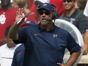 Then UTEP head coach Sean Kugler directs his team from the sidelines in the second quarter of an NCAA college football game against Oklahoma in Norman, Okla., Saturday, Sept. 2, 2017.
