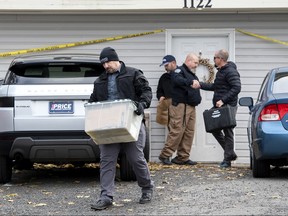 Officers investigate the deaths of four University of Idaho students at an apartment complex south of campus on Monday, Nov. 14, 2022, in Moscow, Idaho.