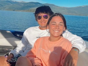 This July 2022 photo provided by Jazzmin Kernodle shows University of Idaho students Xana Kernodle, right, and Ethan Chapin on a boat on Priest Lake, in Idaho. (Jazzmin Kernodle via AP)