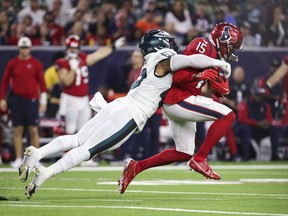 Nov 3, 2022; Houston, Texas, USA; Houston Texans wide receiver Chris Moore (15) runs with the ball as Philadelphia Eagles linebacker Kyzir White (43) attempts to make a tackle during the third quarter at NRG Stadium.