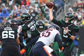 New York Jets quarterback Mike White (5) throws a pass against the Chicago Bears during the first half at MetLife Stadium. (Ed Mulholland-USA TODAY Sports)