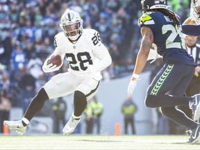 Las Vegas Raiders running back Josh Jacobs rushes against the Seattle Seahawks during the first quarter at Lumen Field.