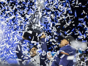 Toronto Argonauts wide receiver Brandon Banks and Toronto Argonauts running back Andrew Harris celebrate after defeating the Winnipeg Blue Bombers  during the 109th Grey Cup at Mosaic Stadium on Sunday, November 20, 2022 in Regina.