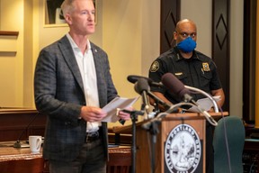 Chuck Lovell, Portland Police Bureau chief, listens to Portland Mayor Ted Wheeler speak to the media at City Hall on August 30, 2020 in Portland, Oregon. (Photo by Nathan Howard/Getty Images)