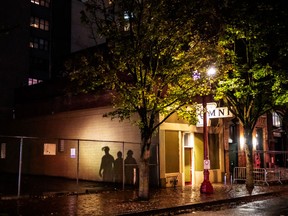 Portland police guard a street corner after dispersing an Indigenous Peoples Day of Rage protest on October 11, 2020 in Portland, Oregon.