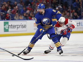 Montreal Canadiens right wing Brendan Gallagher defends as Buffalo Sabres right wing Alex Tuch controls the puck during the second period at KeyBank Center.