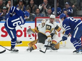 Maple Leafs' Mitch Marner (left) scores a goal against the Vegas Golden Knights during the second period at Scotiabank Arena on Tuesday, Nov. 8, 2022.