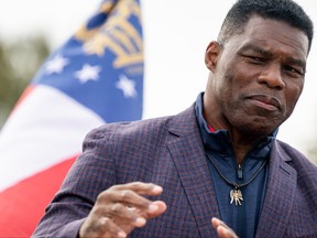 Republican U.S. Senate candidate Herschel Walker speaks to supporters at a campaign rally on Nov. 16, 2022 in McDonough, Ga.