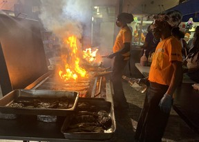 Preparing traditional fish dinners at Oistins. Rita DeMontis/Toronto Sun