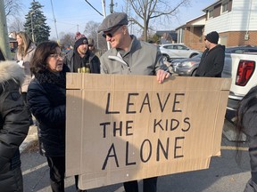 Richard Love holds a Leave the Kids Alone sign outside the Terryberry branch of the Hamilton Public Library on Thursday, Nov. 24, 2022 Joe Warmington/Toronto Sun