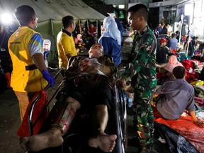 A man injured in an earthquake receives treatment at a hospital in Cianjur, West Java province, Indonesia, November 21, 2022.