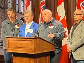 John Di Nino, president of Amalgamated Transit Union (ATU) Canada, second from right, with union leadership, speaks at Queen's Park in Toronto on Wednesday, Nov. 9, 2022.