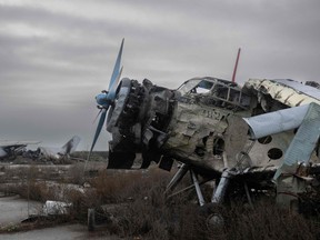 This photograph taken on Nov. 20, 2022, shows a damaged plane next to others destroyed at the International Airport of Kherson in the village of Chornobaivka, outskirts of Kherson, amid the Russian invasion of Ukraine.