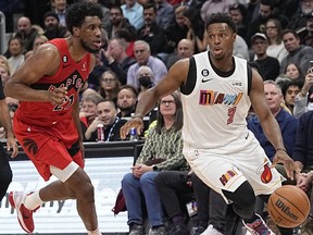 Miami Heat guard Kyle Lowry (7) drives to the net against Toronto Raptors forward Thaddeus Young (21) during the first half at Scotiabank Arena.