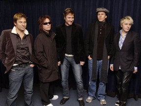 Duran Duran -- left to right. Roger Taylor, Andy Taylor, Simon Le Bon, John Taylor and Nick Rose - pose for a 'photoshoot' after a press conference in Vancouver on March 5, 2005.