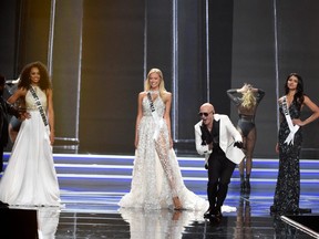 Singer Pitbull performs next to some of the Miss USA finalists in Las Vegas, May 14, 2017.