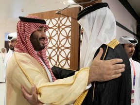 Saudi Arabia Crown Prince and Prime Minister Mohammed bin Salman is received by Qatari Emir Sheikh Tamim bin Hamad al-Thani on the sidelines of the World Cup in Doha, Qatar, Sunday, Nov. 20, 2022.