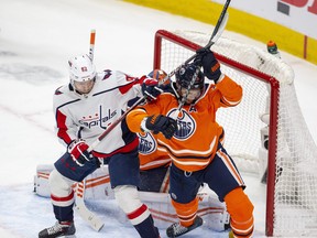 Edmonton Oilers Darnell Nurse (25) battles with Washington Capitals Evgeny Kuznetsov (92) during second period NHL action on Wednesday, March 9, 2022 in Edmonton.