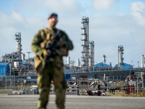 A Norwegian Home Guard soldier stands guard, assisting the police with increased security, at the Karst gas processing plant in the Rogaland county, Norway, on October 3, 2022.
