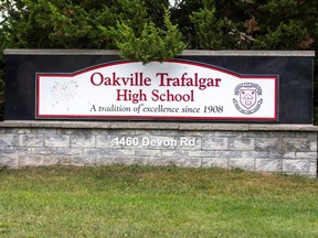A sign for Oakville Trafalgar High School in Oakville, Ont., is seen Sept. 19, 2022.