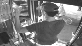 Sammy Yatim puts his hands up as police arrive in Toronto on July 26, 2013 in this still taken from court handout surveillance video. THE CANADIAN PRESS/Ontario Superior Court of Justice