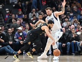 Toronto Raptors guard Fred VanVleet dribbles the ball past Dallas Mavericks guard Luka Doncic at Scotiabank Arena Saturday night. Dan Hamilton/USA TODAY SPORTS