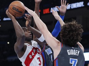 Toronto Raptors forward OG Anunoby (3) is defended by Oklahoma City Thunder guard Josh Giddey (3) on a shot in the second quarter at the Paycom Center.