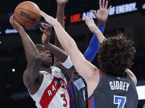 Toronto Raptors forward O.G. Anunoby (3) is defended by Oklahoma City Thunder guard Josh Giddey (3) on a shot during the second quarter at Paycom Center.