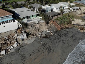 A view shows destroyed backyards of beachfront houses, after Hurricane Nicole made landfall on Florida's east coast, in Daytona Beach Shores, Florida, November 11, 2022.
