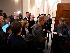 People attend the trial of the two brothers who are suspected of having spied on Sweden for ten years for the Russian intelligence service GRU, in district court, Stockholm, Sweden November 25, 2022.