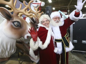 Santa with Mrs Claus inspect their new reindeer for their float in Santa's secret workshop in preparation for the 118th Original Santa Claus Parade.