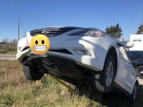 A white Hyundai seemed to be floating in the air in Burlington in two photos sent out by the OPP Highay Safety Division on Tuesday via its @OPP_HSD twitter account.