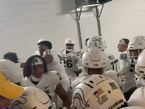 Seven Michigan State players have been charged in Michigan tunnel fracas.