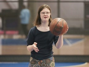 Simone Randmaa, 16, a huge sports fan who likes playing basketball, swimming and singing Celine Dion songs, fires buckets galore at Variety Village in Scarborough, Ont., on Friday, Nov. 18, 2022.