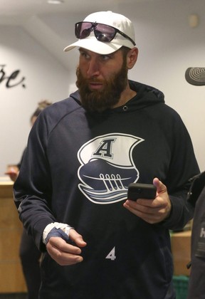 Toronto Argonauts quarterback McLeod Bethel-Thompson, his right hand and thumb wrapped, meets with the media as the team arrived at Pearson airport on Nov. 21, 2022.