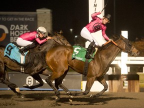 Jockey Sahin Civaci guides Candy Overload to victory in the $175,000 Kennedy Road Stakes at Woodbine on Nov. 27, 2022. Candy Overload covered the six furlongs in 1.09 for owner Gary Barber and trainer Mark Casse.