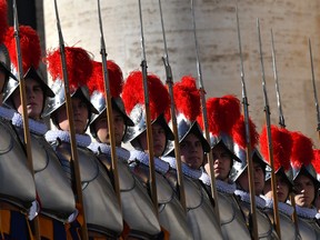 Swiss guards parade before the arrival of Pope Francis' at the balcony at St Peter's square in Vatican, on December 25, 2019.