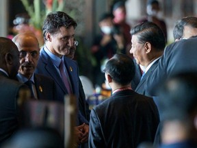 Prime Minister Justin Trudeau speaks with China's President Xi Jinping at the G20 Leaders' Summit in Bali, Indonesia, Nov. 15, 2022.