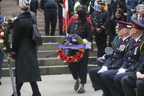 Toronto Sun Editor-in-Chief Adrienne Batra prepares to deliver a grand tribute to the Churchill Society during the Remembrance Day Service at the Toronto Cenotaph at Old City Hall on Friday, November 11, 2022.