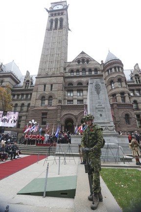 One of four sentries stands guard as the clock strikes 11 a.m. during the Remembrance Day service at the Toronto Cenotaph at Old City Hall on Friday, November 11, 2022.