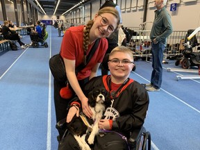 Eliana and Jacob McArthur at Volt World Cup in Sweden, with Team USA’s spaniel puppy mascot.
