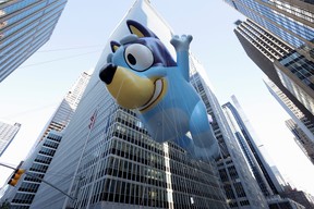High-flying balloon figures are the stars of the US Thanksgiving Parade 4 The Bluey Balloon flies during the 96th Macy's Thanksgiving Day Parade in Manhattan, New York on November 24, 2022.