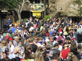 Guests crowd the Harambe village area of Disney's Animal Kingdom Dec. 30, 2021.