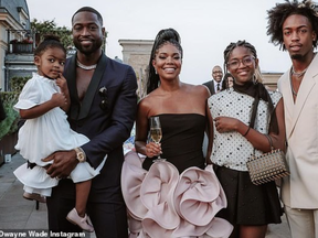 Dwayne Wade (left), with family, including daughter Zaya (second from left).